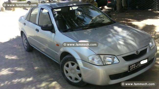 Mazda 323 ancienne voiture diplomatique