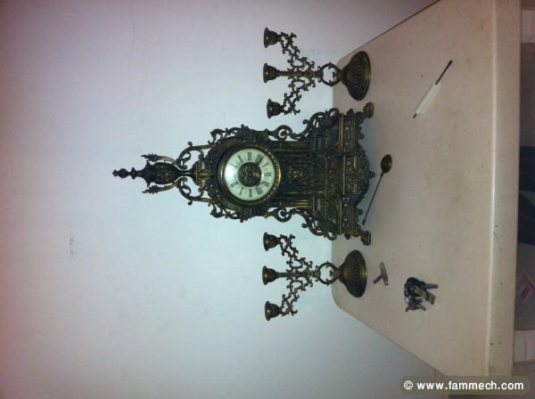 pendule avec 2 chandelier ,en état de marche 